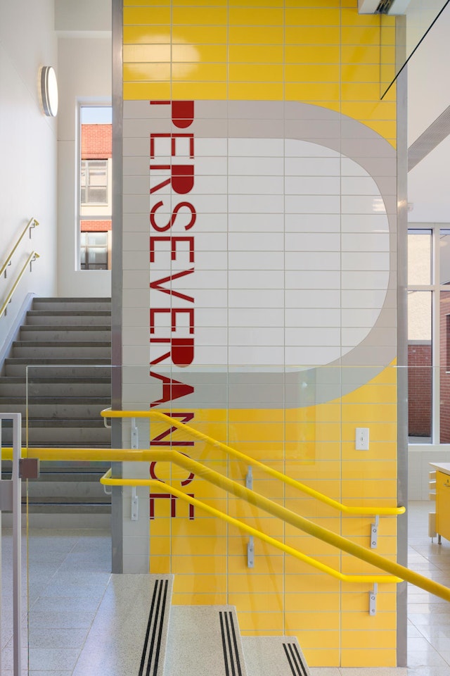 Large-scale typography is combined with the architecture to create a dynamic environment.