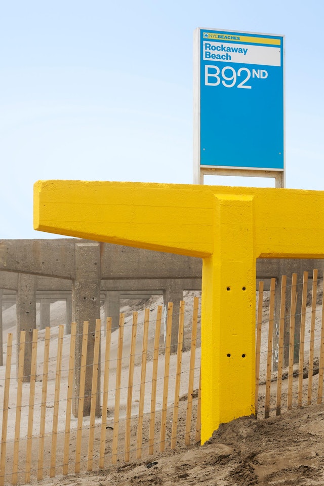 The stanchions are painted yellow at entry and exit points along the beach.