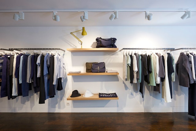 A simple hanging and shelving system is used, inspired by the brand's flagship store in London