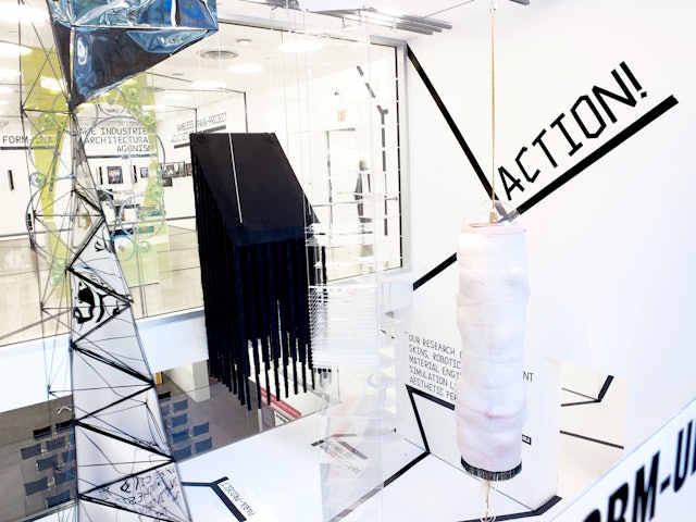 The exhibition design extends the strong black line of the identity into a dimensional environment.