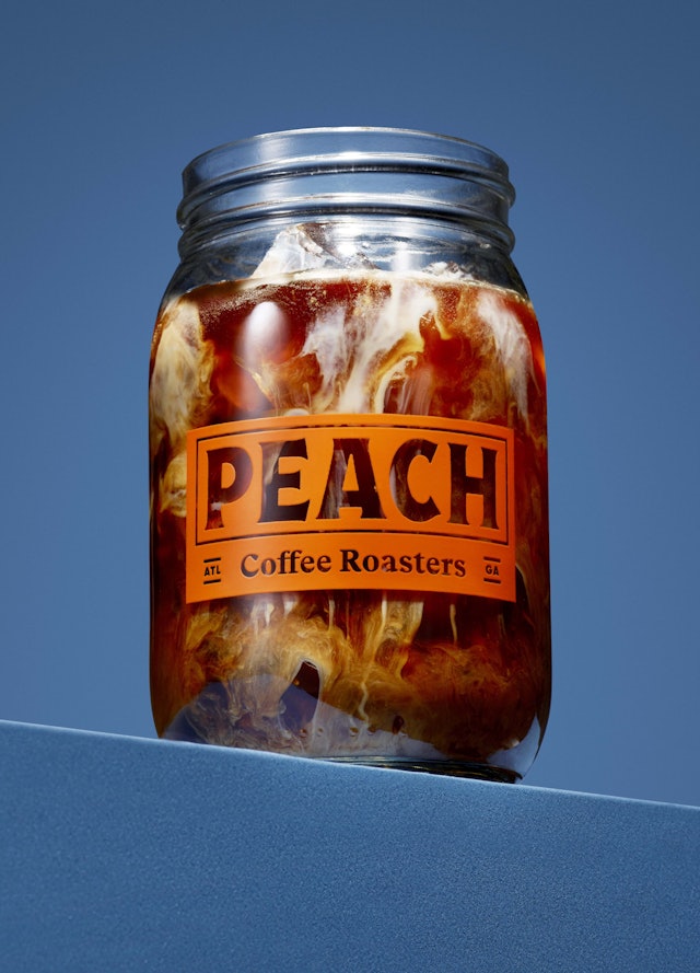 Coffee glass is a Mason Jar used for canning peaches.