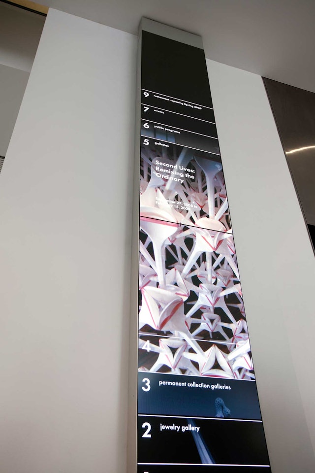 Directional totem in the museum's lobby, part of the program of dynamic media.