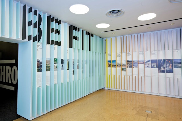 A pattern of dimensional panels extending from the walls activates the space and frames the content.