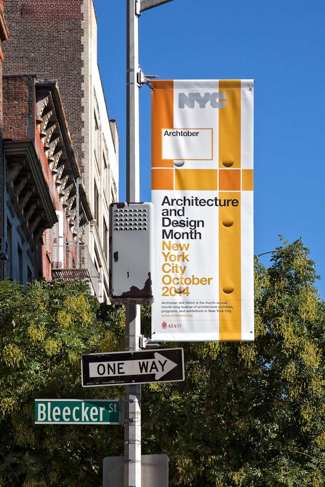Promotional banner on Bleecker Street.