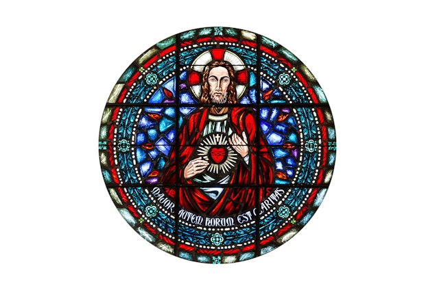 The Rose Window from LMU’s Sacred Heart Chapel includes a version of the Jesuit seal.