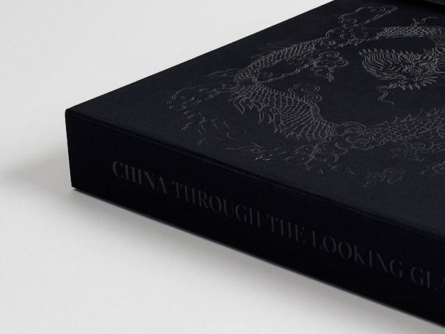 The box is embossed with an image of a dragon.