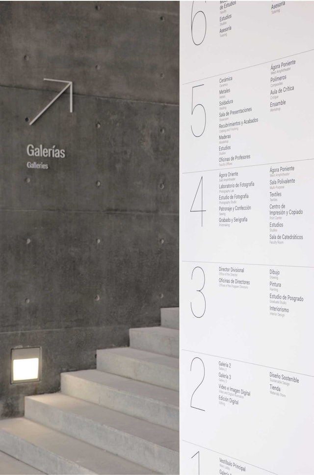 In contrast to the building's concrete, the environmental graphics are in shiny, smooth materials.