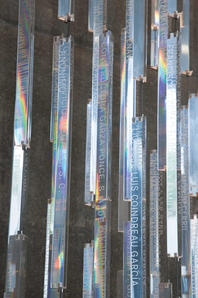 Names of donors are engraved on prism-like Plexiglas rods that change with the light.