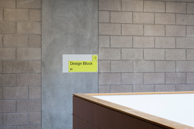 This consistent background plate allows visitors to easily identify signage