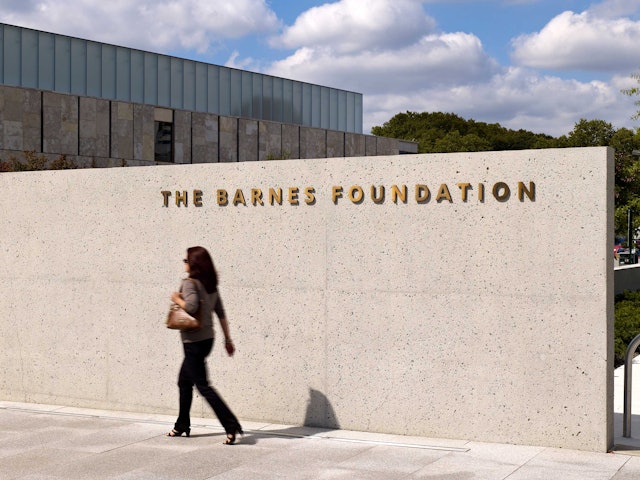 The name of the Foundation appears in metal lettering pin-mounted to the building at the entrance.