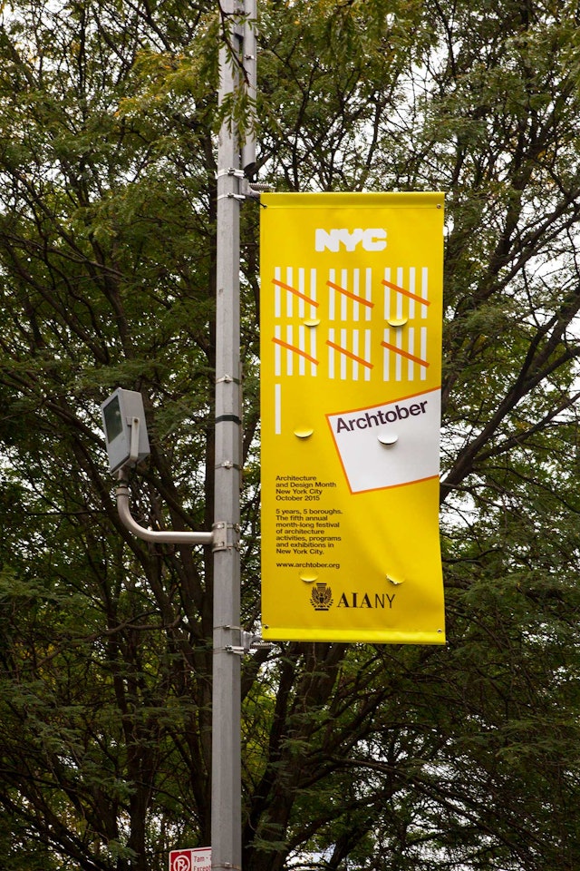 The Archtober identity applied to a street banner.