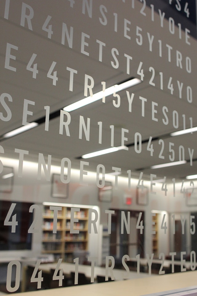 Code detail on library glass wall.