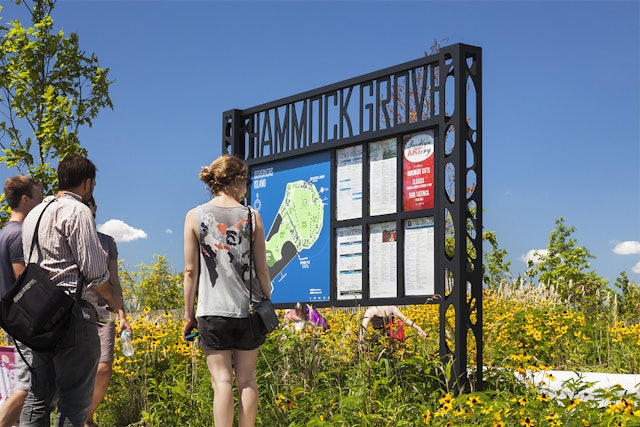 The trellis-like signage at Governors Island is inspired by the gantries at its docks.