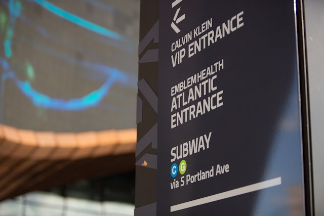 The signage provides directions to Atlantic Terminal, a major transportation hub.