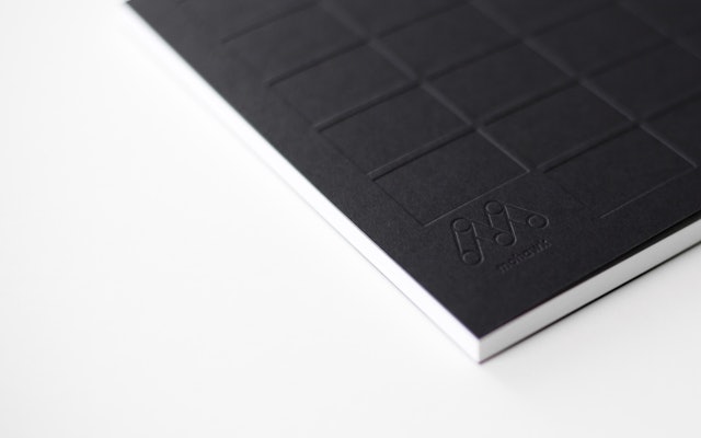 The grid is embossed in the front and back cover of the book.
