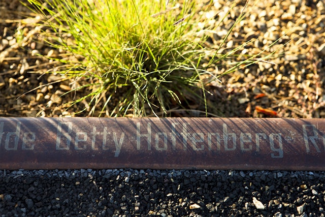 Donor recognition signage etched in railroad tracks in the Railway Gardens section of the park.