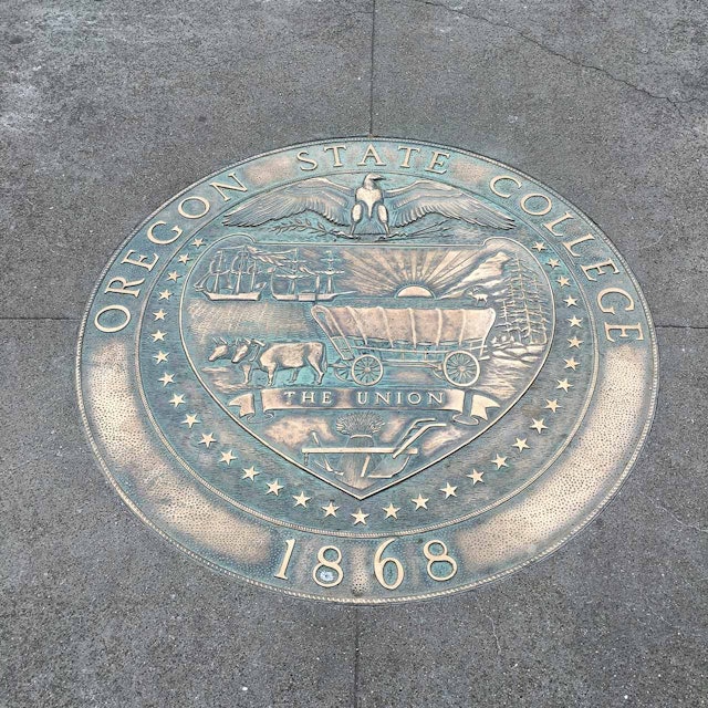 A bronze plaque in the center of campus displays OSU