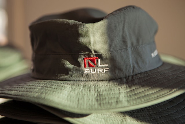The shorthand logo. A floppy surf hat is a good thing to have in the Texas sun.